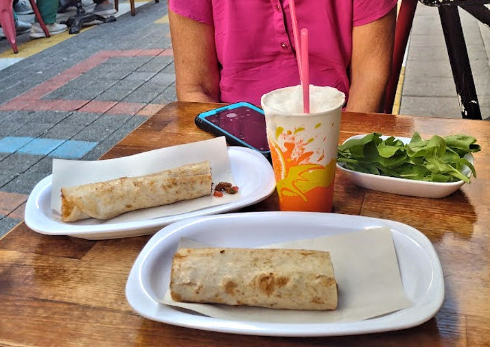 Tatuni boiled and fried meat wrapped in bread)