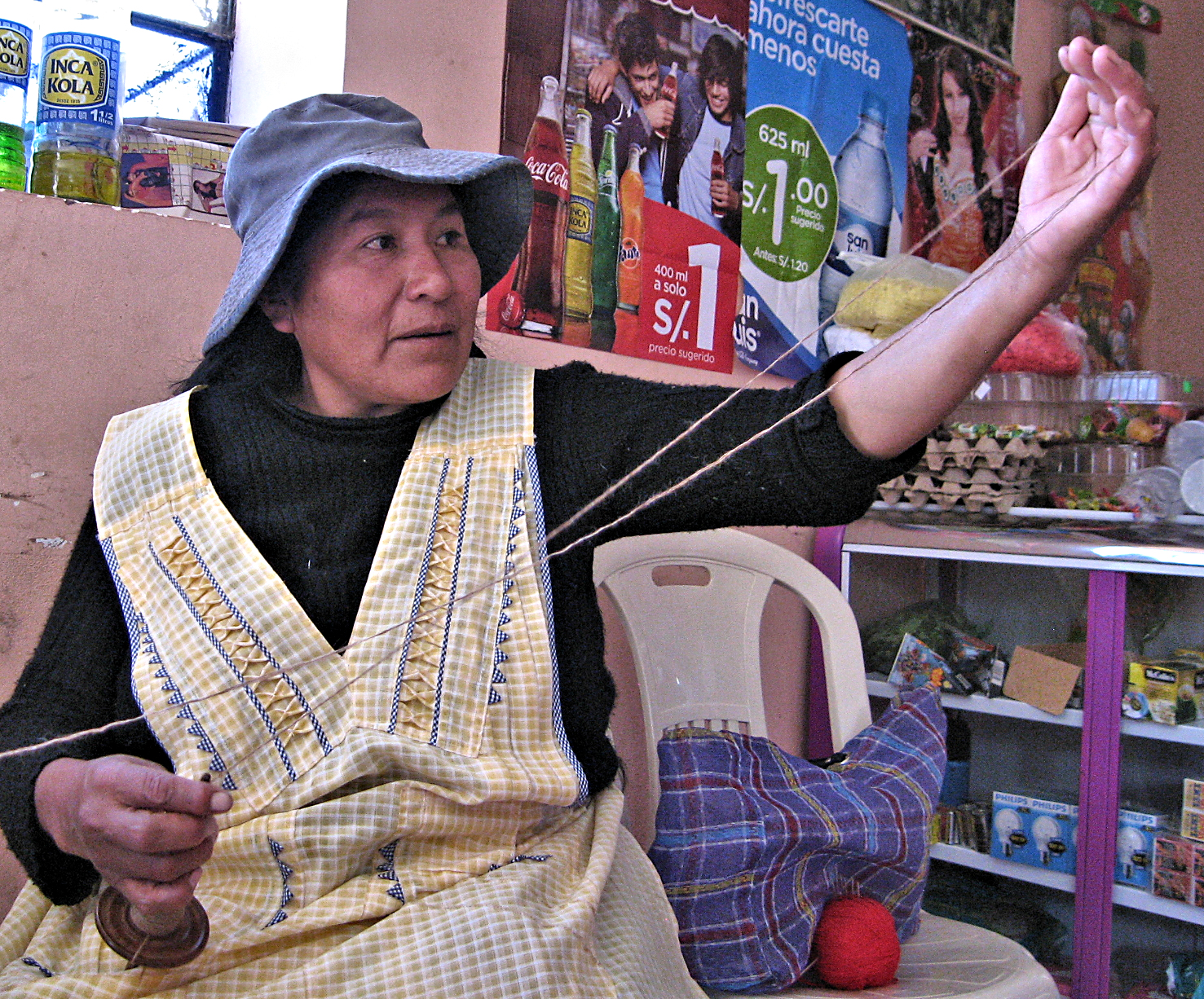 Delfina Spinning in her store.