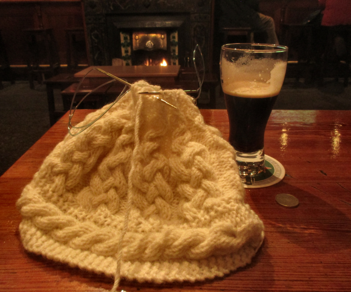 Knitting hat and Guiness in a cozy pub on the Isle of Aran.