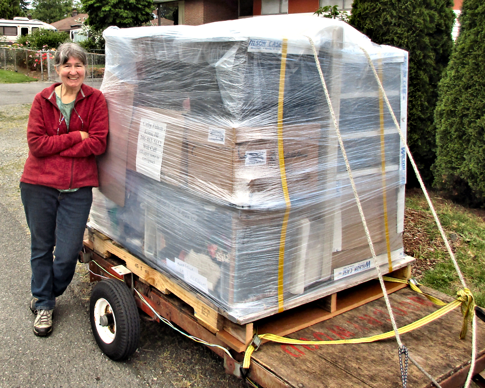 Cathy with a pallet loaded with the last of her possessions