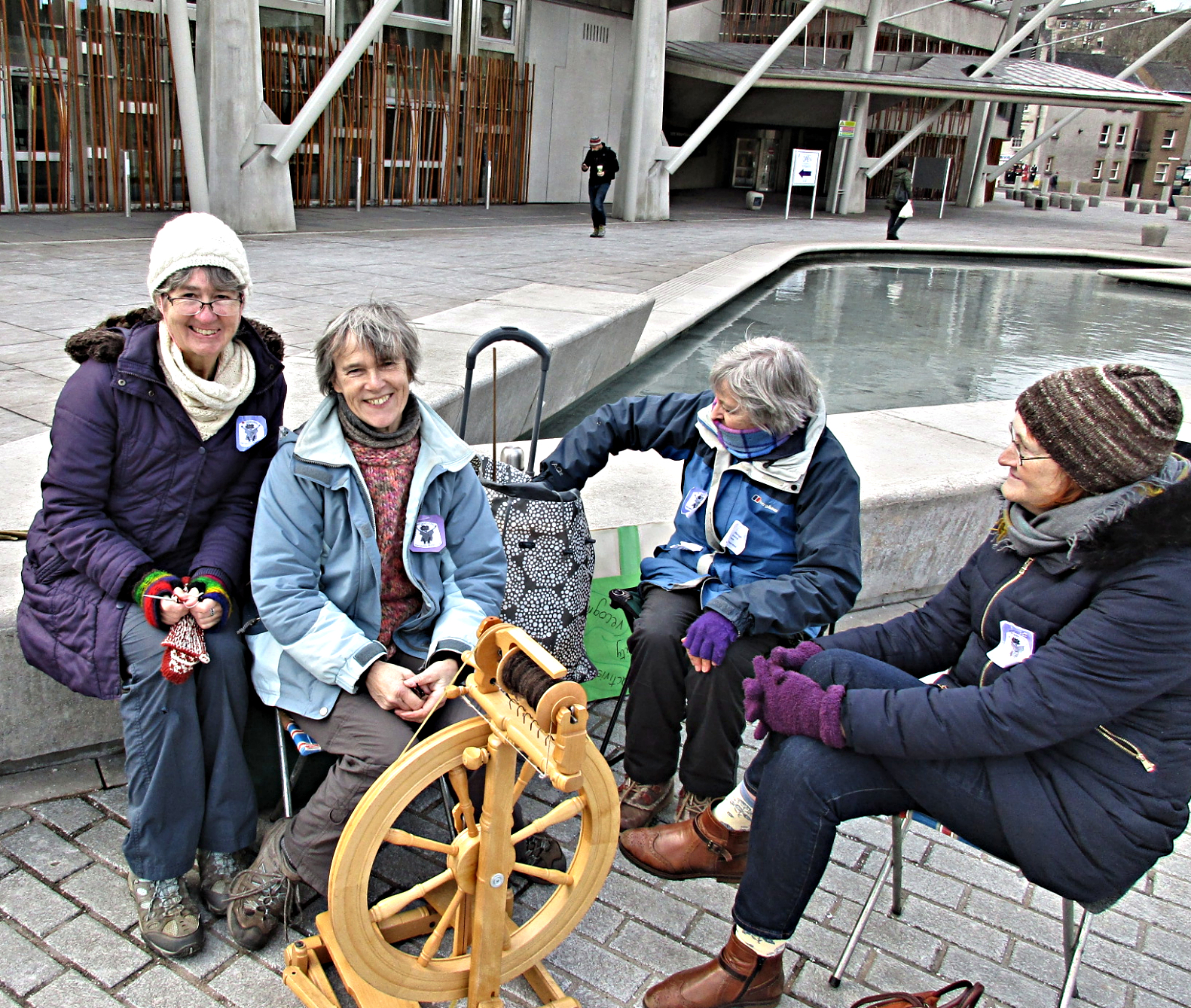 Knitting & spinning yarn in front of the Scottish Parliament for International Women's Day