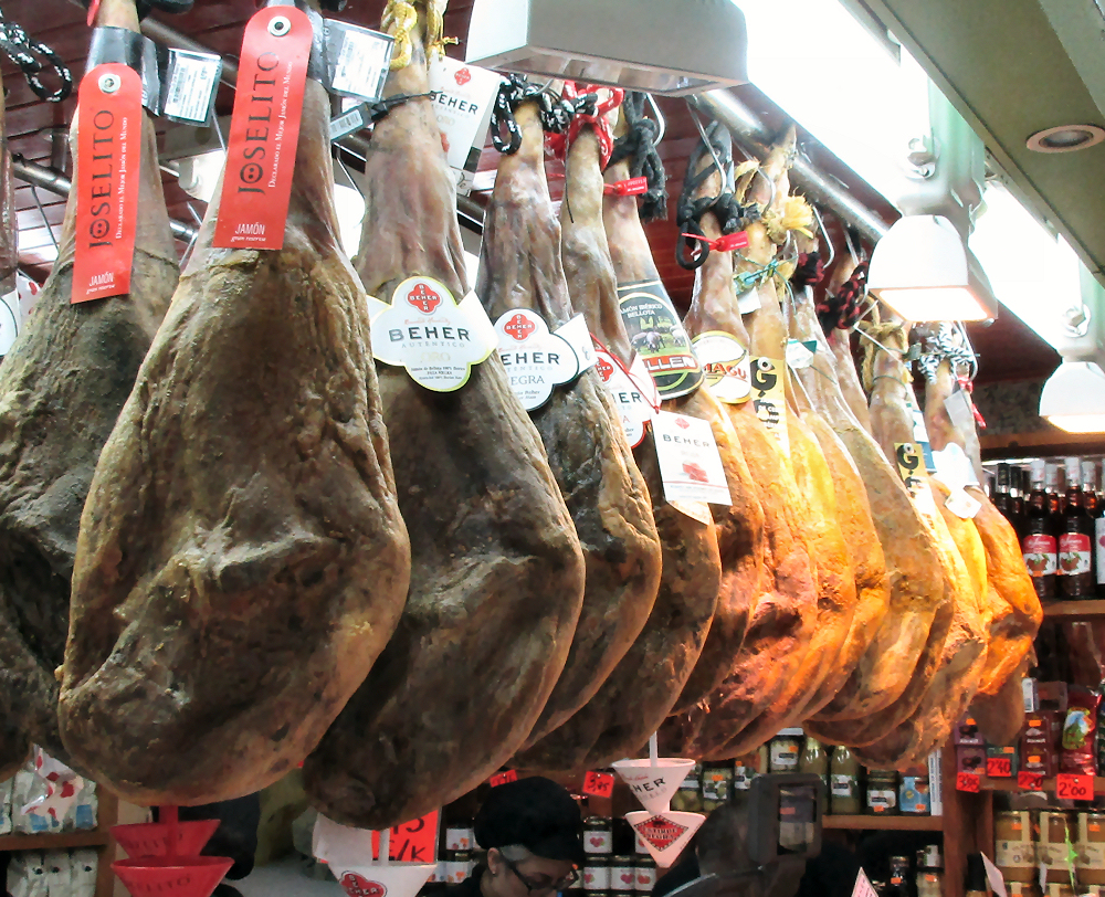 Hams hanging over a stall at the Central Market in Oviedo