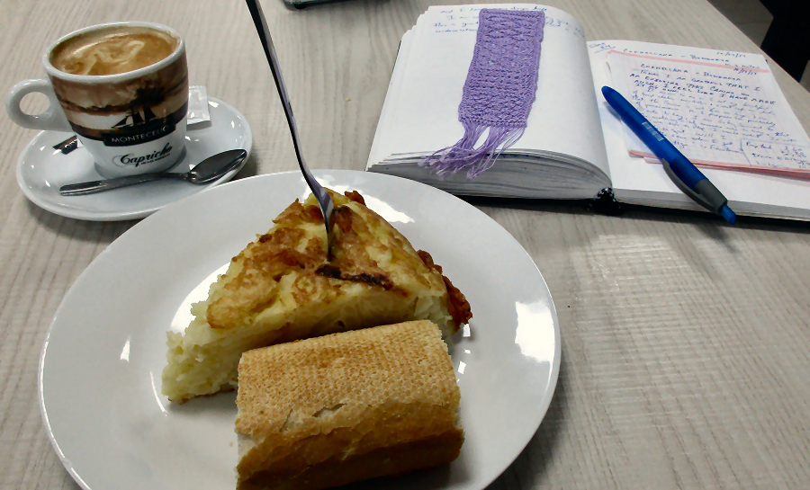 My morning snack of tortilla, bread, and cafe con leche with my journal in the background