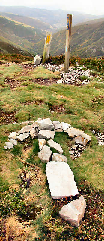 Large arrow made from rocks on the trail