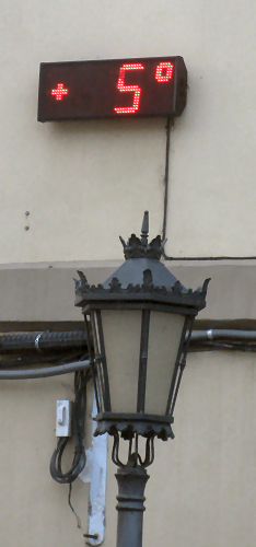 Street lamp and temperature sign showing 5 degrees C.