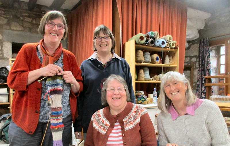 Group of women in a weaving studio