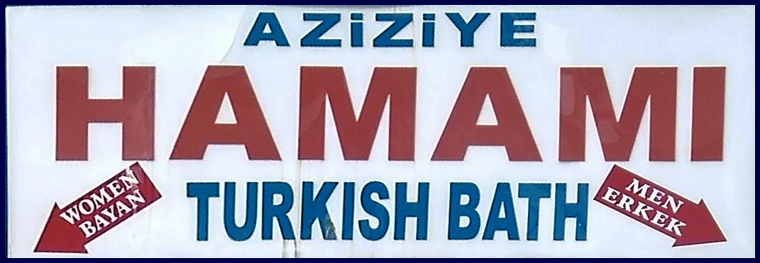 Sign over the door of the Hamam. It reads Aziziye Hamami, Turkish Bath. And has arrow to different doors for men and women