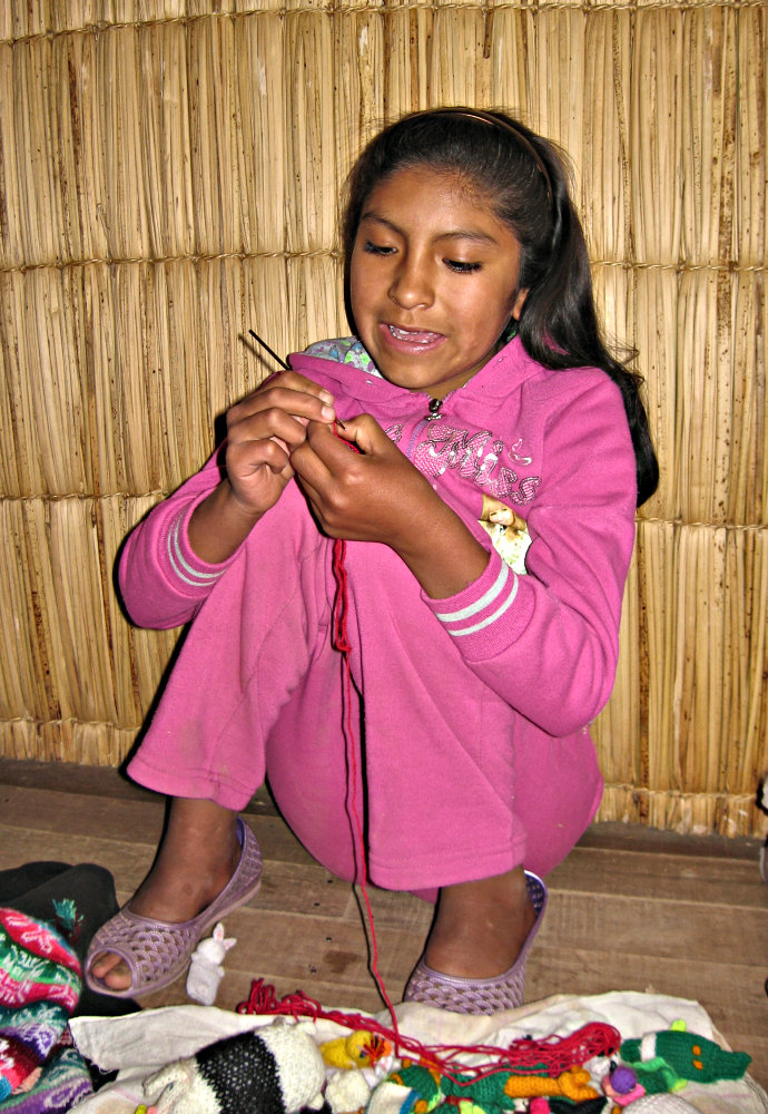 Meliza chrocheting a flower