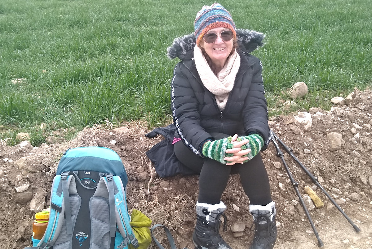 Cathy with pack and poles ready to walk the Camino