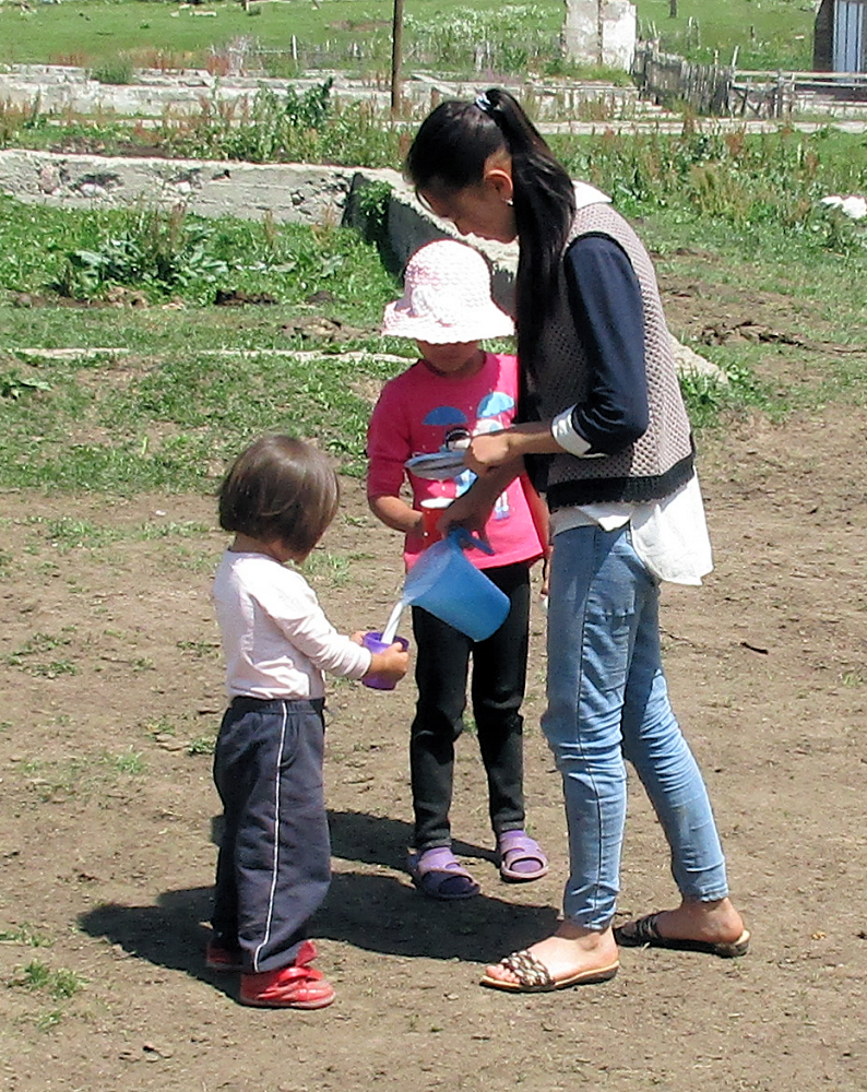 Children receiving cups of fresh mare's milk