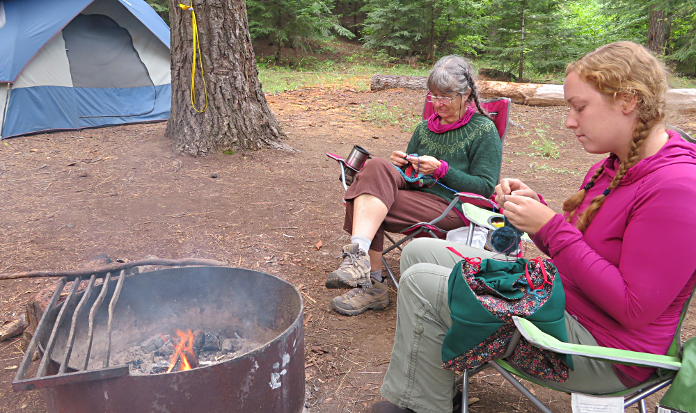 Rebecca & Cathy knitting by the campfire