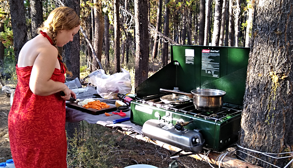 Daughter Rebecca cooking on a makeshift camp kitchen.