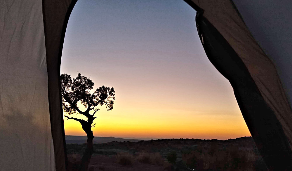 Sunrise greeted us from our tent door in the Grand Staircase-Escalante of Southern Utah.
