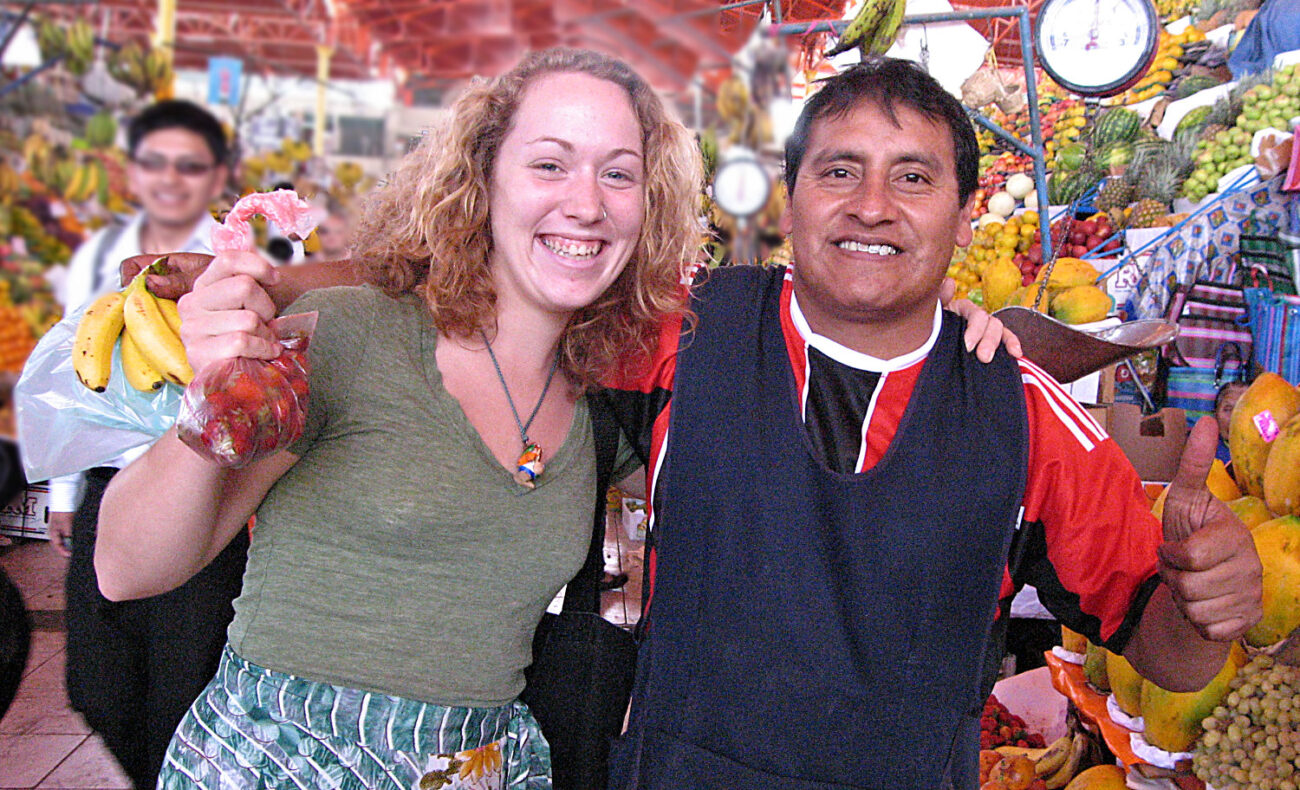 Rebecca with fruit vendor in the San Camillo market