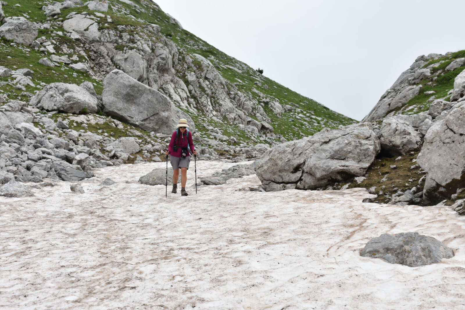 Walking across a patch of Snow in Albanian Alps