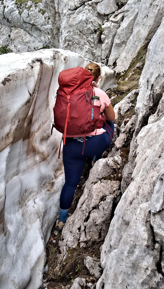Rebecca finding her way around a snowfield in the Peaks of the Balkans