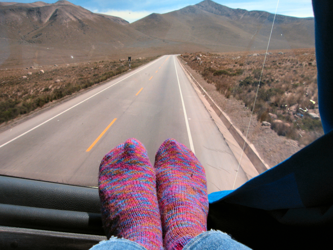 Image of Traveling Socks in the bus window