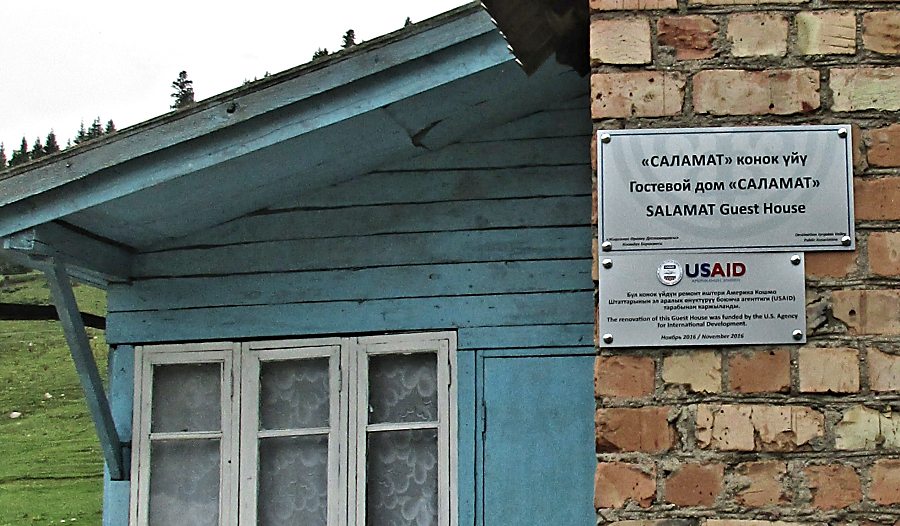 A sign indicates that USAID funds were used to help renovate my guesthouse.