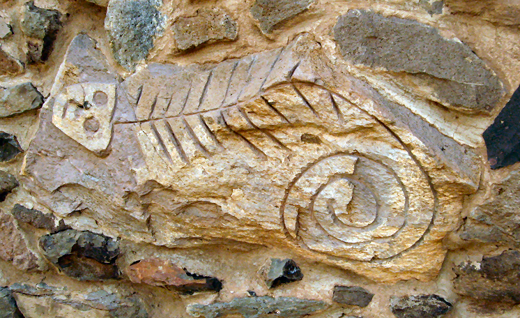 Stone artwork on the walls around the posada