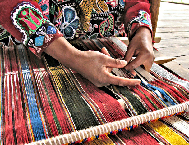 Up close image of Quechua woman weaving