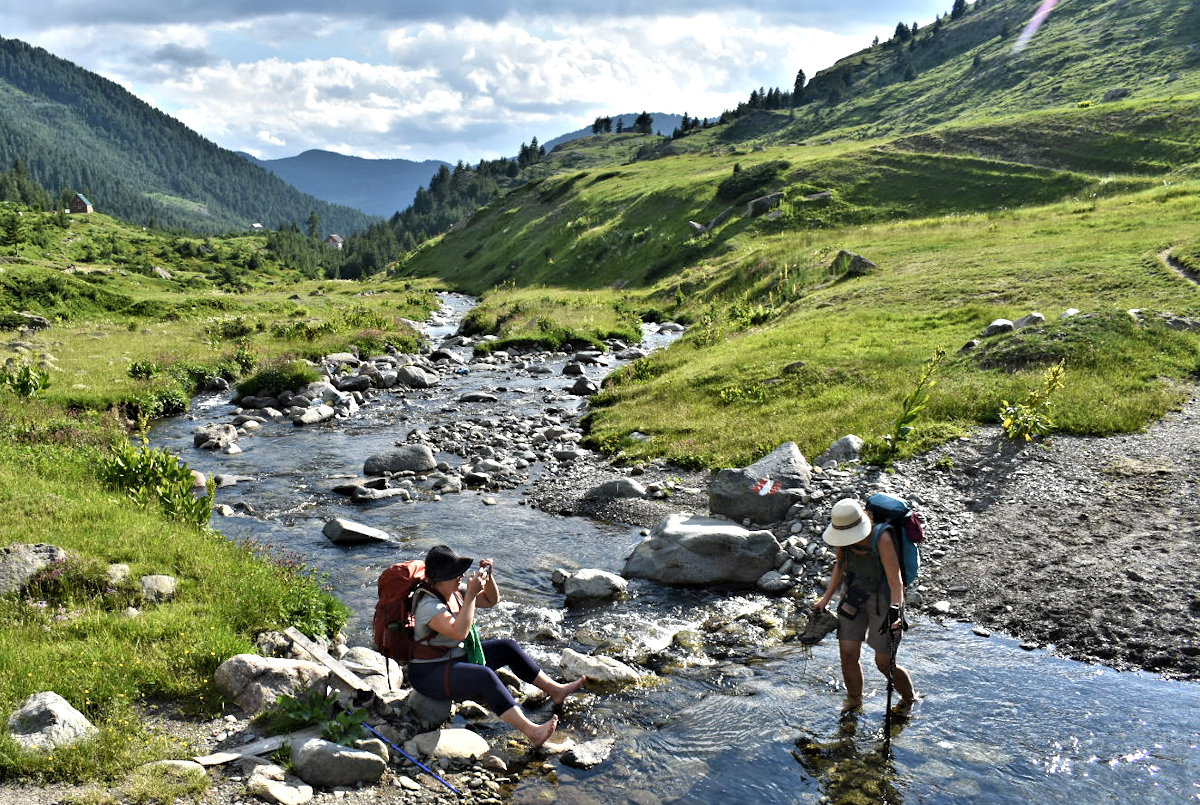 Cathy wading the river in order to enter the village of Doberdol.